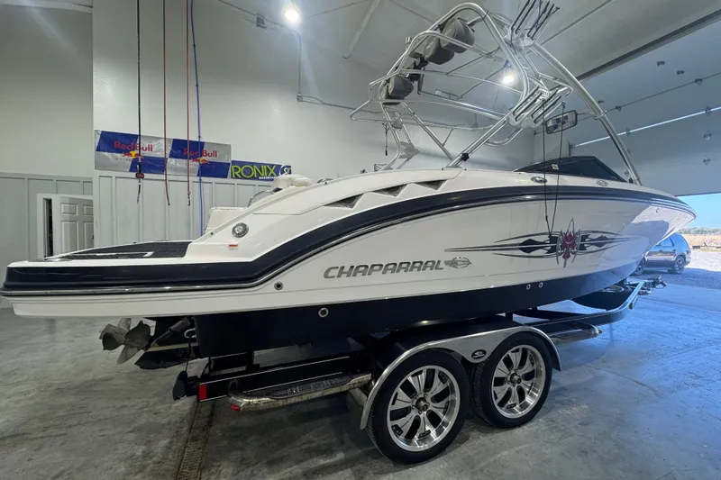 Slide: The Image of 2008 Chaparral Sunesta 244 Xtreme boat on trailer in indoor storage. - 4