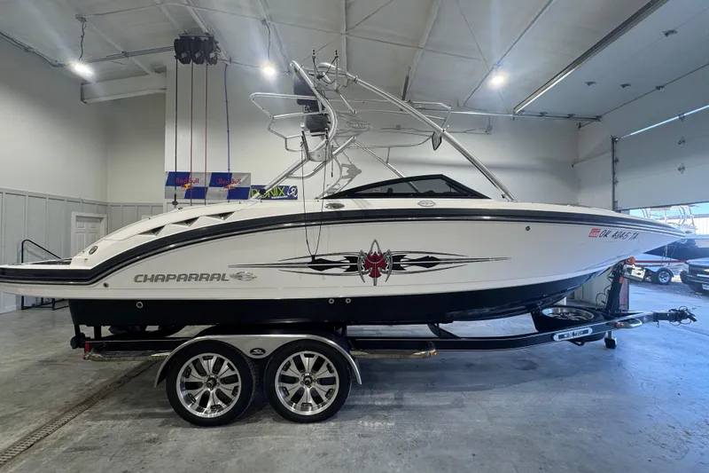 Slide: The Image of 2008 Chaparral Sunesta 244 Xtreme boat on trailer in indoor storage facility. - 5