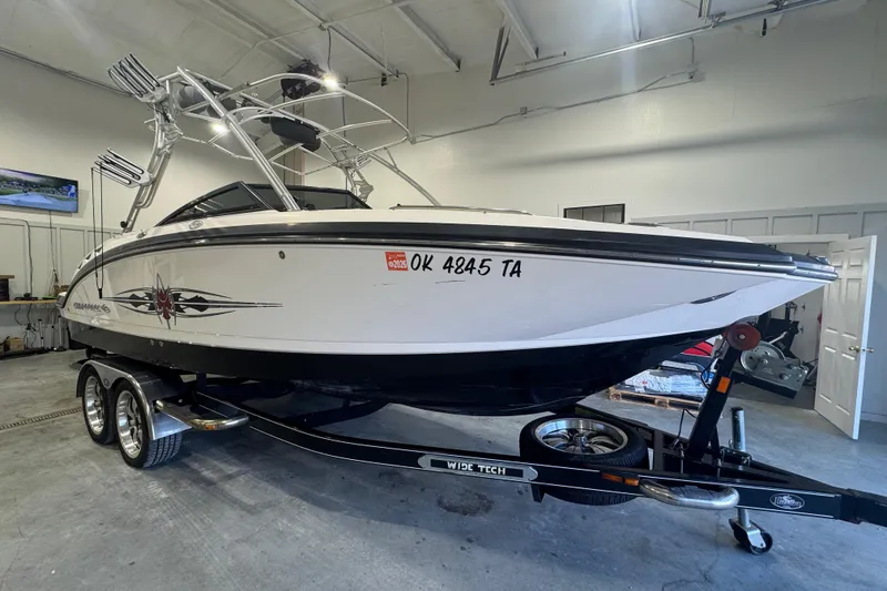 Slide: The Image of 2008 Chaparral Sunesta 244 Xtreme boat on trailer in indoor storage. - 6