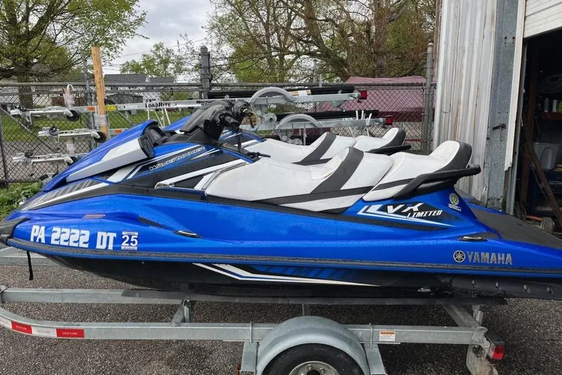 Slide: The Image of 2017 Yamaha WaveRunner VX Limited jet ski on trailer, blue and white design. - 3