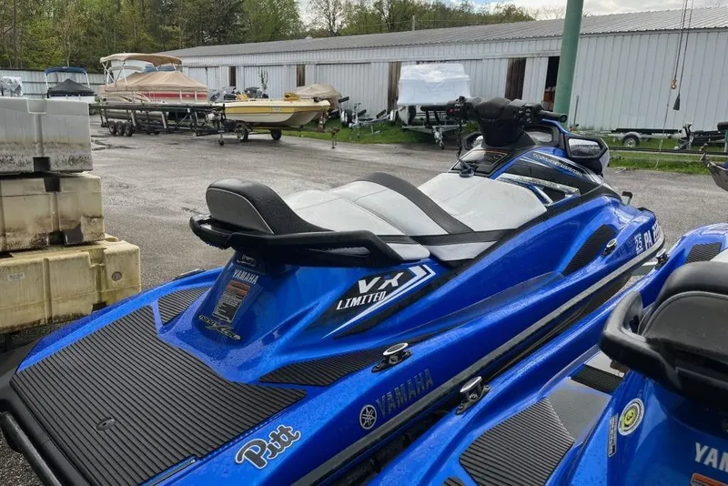 Slide: The Image of 2017 Yamaha WaveRunner VX Limited in blue, parked outdoors near boats. - 4
