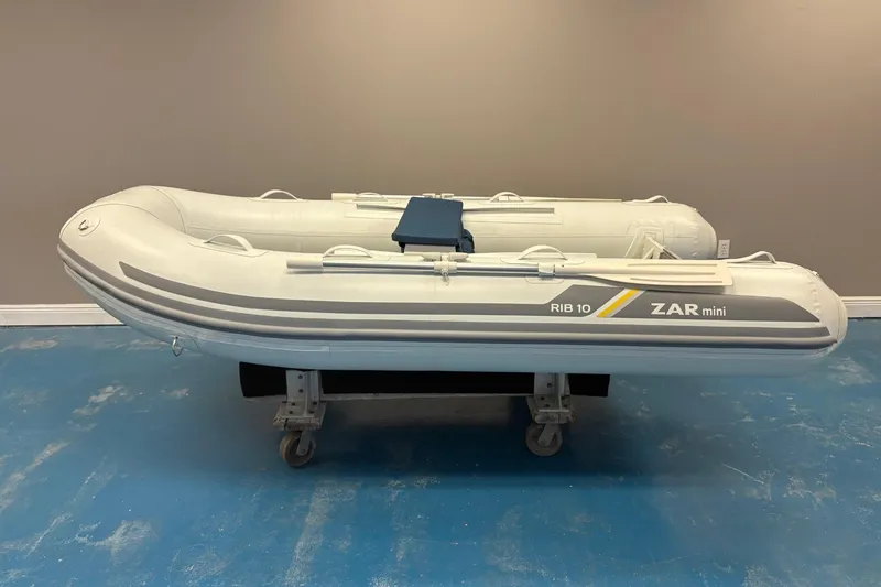 Slide: The Image of 2022 ZAR Mini 10 Lite inflatable boat on display indoors. - 1