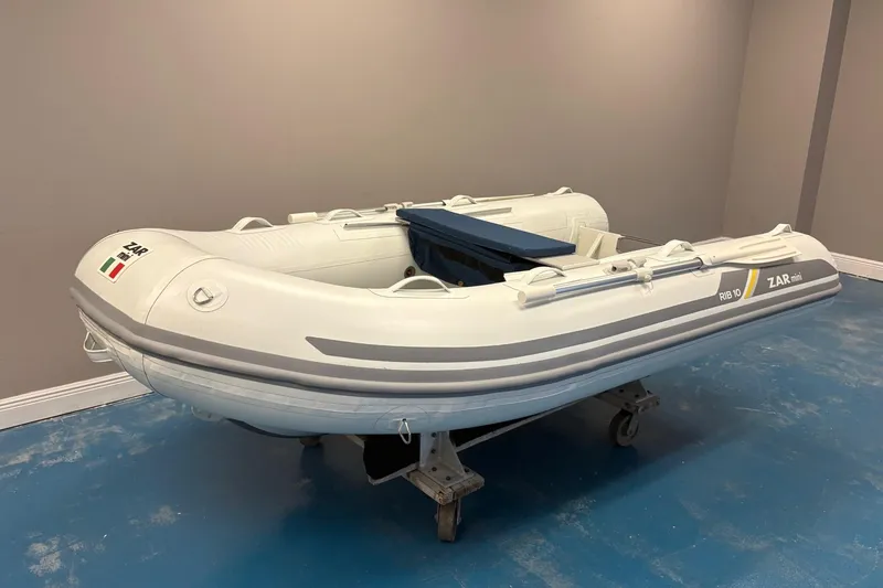 Slide: The Image of 2022 ZAR Mini 10 Lite inflatable boat on display indoors. - 2