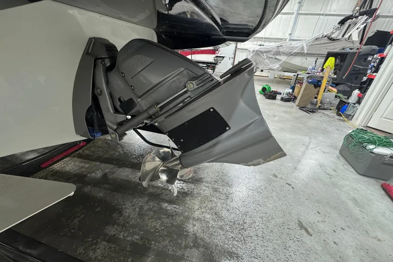 Slide: The Image of 2021 Crownline Eclipse E255 SURF boat propeller in a garage setting. - 3
