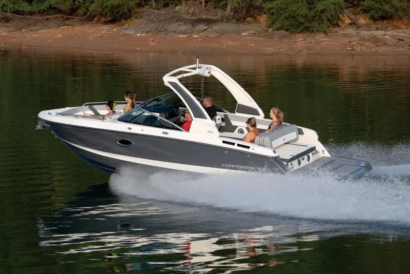 The Image of Manufacturer Provided Image: Manufacturer Provided Image: 2025 Chaparral 267 SSX speedboat cruising on a serene lake with passengers onboard. - 0