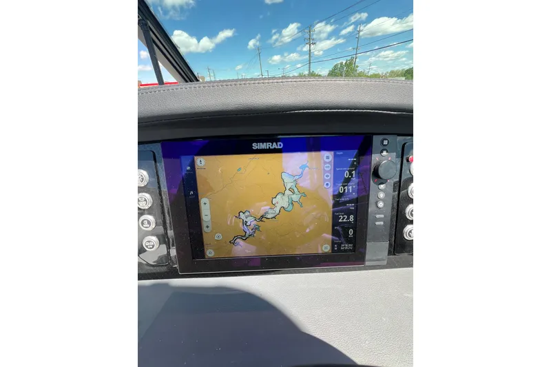 Slide: The Image of Dashboard of 2026 Chaparral SSX 6 with Simrad navigation display. - 12