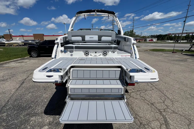 Slide: The Image of 2026 Chaparral SSX 6 boat with extended swim platform and seating, displayed outdoors. - 14