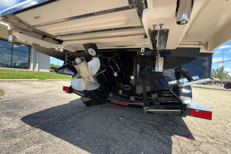 Slide: The Image of 2026 Chaparral SSX 6 boat propeller and stern view in a parking lot. - 16