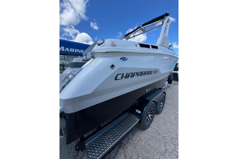 Slide: The Image of 2026 Chaparral SSX 6 boat on trailer, displayed outdoors under blue sky. - 18