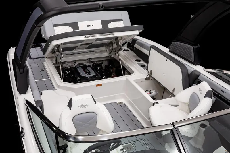 Slide: The Image of Manufacturer Provided Image: Manufacturer Provided Image: 2025 Chaparral 267 SSX boat interior with open engine compartment and luxury seating. - 6