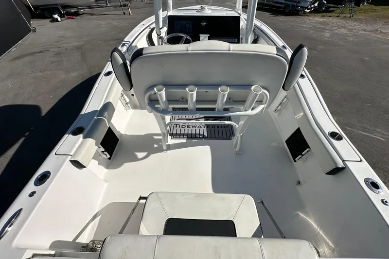 Slide: The Image of 2023 Tidewater 210 CC Adventure boat on trailer under bright sun. - 10