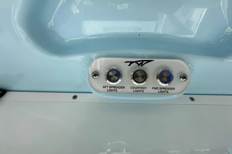 Slide: The Image of 2023 Tidewater 210 CC Adventure boat interior with helm and seating area. - 19