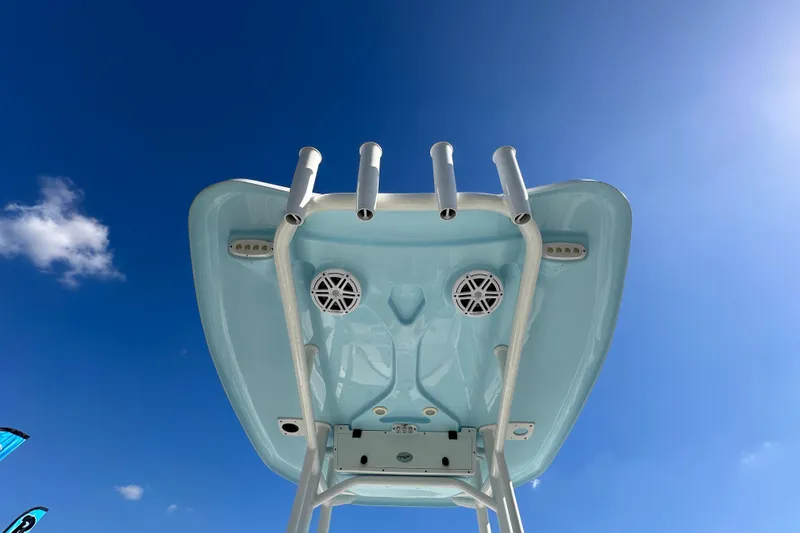 Slide: The Image of 2023 Tidewater 210 CC Adventure boat interior with steering console and seating. - 20