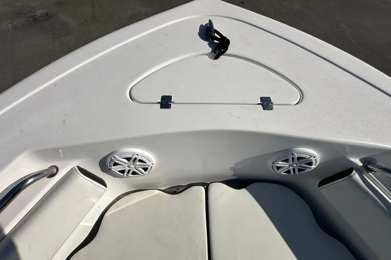 Slide: The Image of 2023 Tidewater 210 CC Adventure boat deck with logo and textured mat. - 23