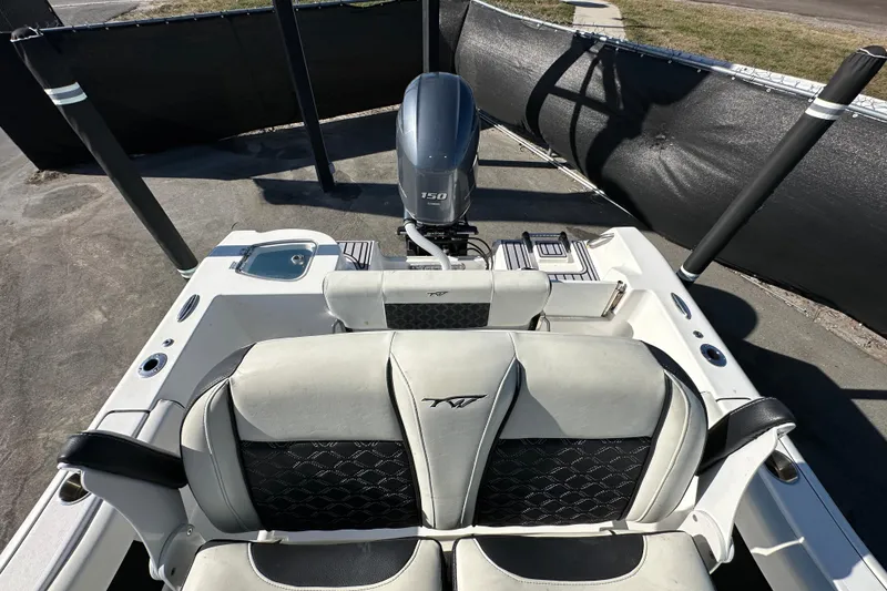 Slide: The Image of 2023 Tidewater 210 CC Adventure boat console with lights and controls. - 30