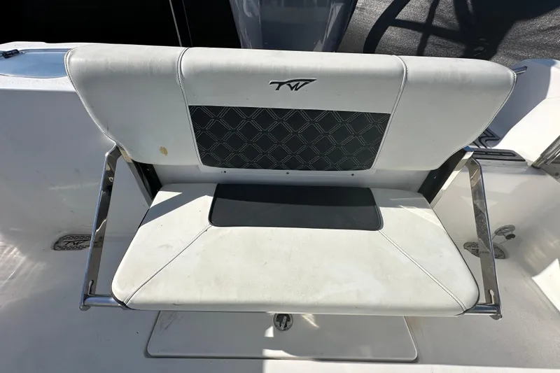 Slide: The Image of Open storage compartment on 2023 Tidewater 210 CC Adventure boat, showing wiring and interior details. - 32
