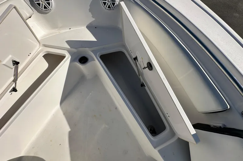 Slide: The Image of Battery switch on 2023 Tidewater 210 CC Adventure boat, enclosed in a white panel. - 39