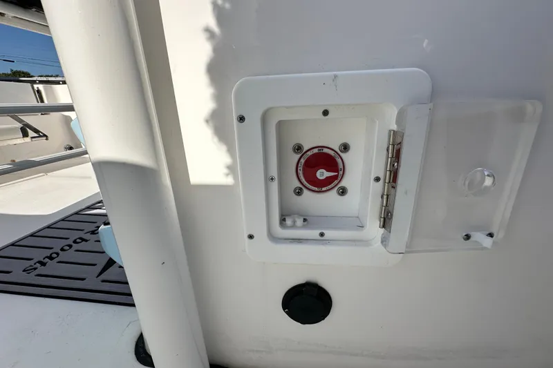 Slide: The Image of 2023 Tidewater 210 CC Adventure boat interior with cushioned seating and speakers. - 41