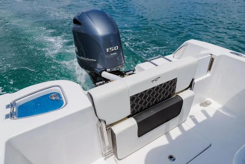 Slide: The Image of 2023 Tidewater 210 CC Adventure boat with 150 horsepower engine, outdoor display. - 5