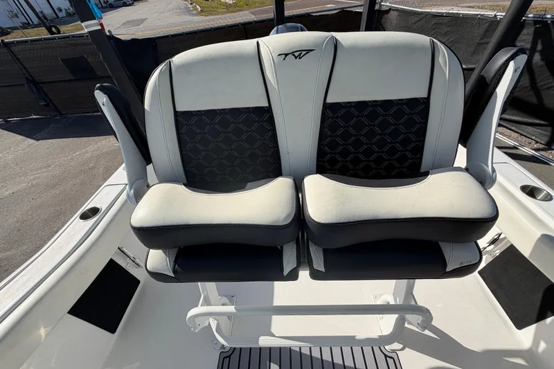 Slide: The Image of 2023 Tidewater 210 CC Adventure boat seats with stylish black and white design. - 56