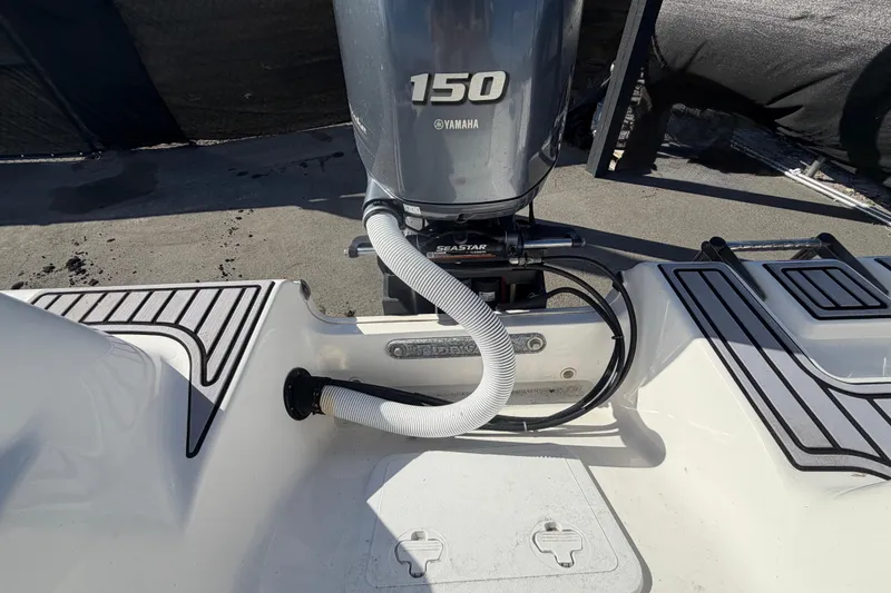Slide: The Image of 2023 Tidewater 210 CC Adventure boat with Yamaha 150 engine, rear view. - 62
