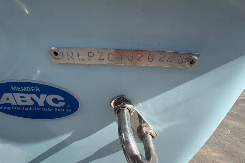 Slide: The Image of Trailer wheels of 2023 Tidewater 210 CC Adventure boat on pavement. - 63