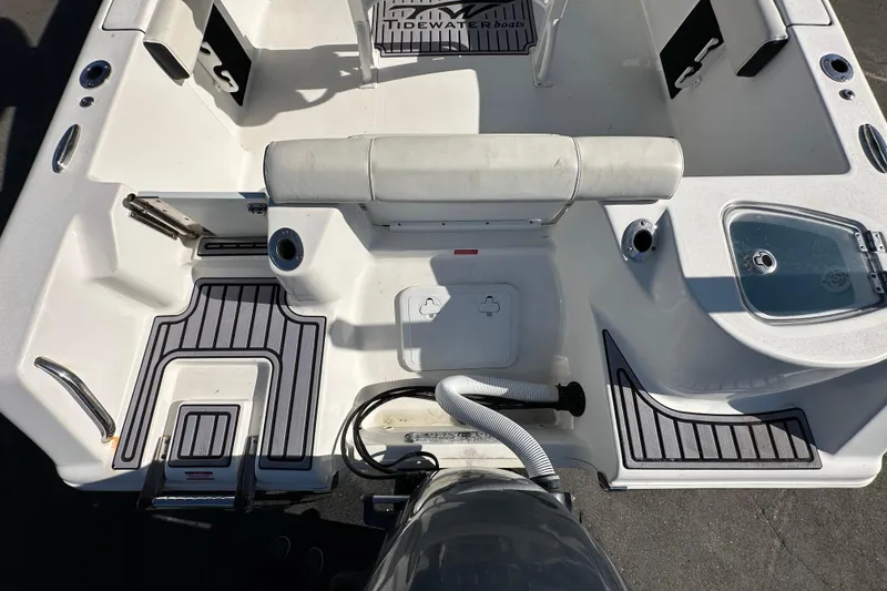 Slide: The Image of 2023 Tidewater 210 CC Adventure boat on trailer under sunny sky. - 9