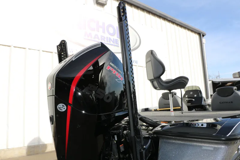 Slide: The Image of 2025 Caymas CX 21 PRO boat with Mercury 250 engine, outdoor display. - 13