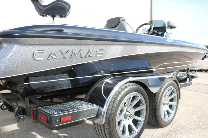 Slide: The Image of 2025 Caymas CX 21 PRO boat on trailer, showcasing sleek design and metallic finish. - 14