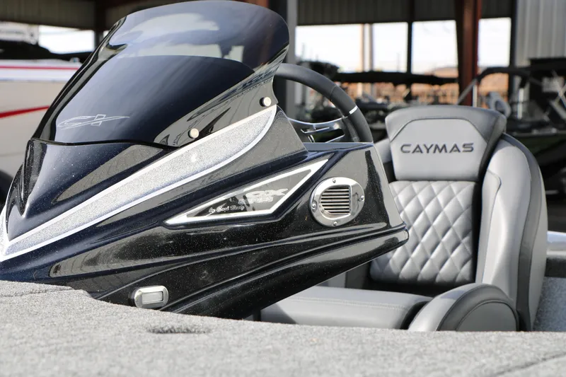Slide: The Image of 2025 Caymas CX 21 PRO boat interior with sleek design and comfortable seating. - 19