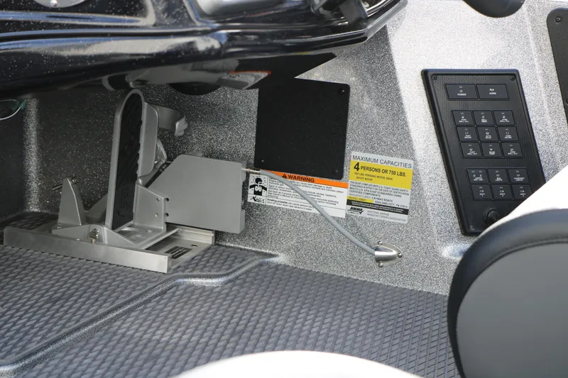 Slide: The Image of Interior view of 2025 Caymas CX 21 PRO boat controls and foot pedal. - 22