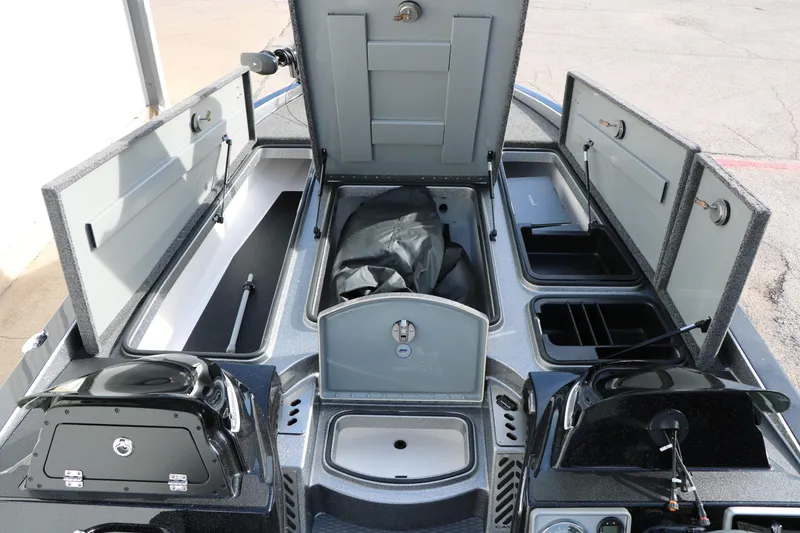 Slide: The Image of 2025 Caymas CX 21 PRO boat interior with open storage compartments and sleek design. - 32