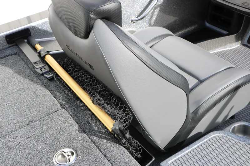 Slide: The Image of 2025 Caymas CX 21 PRO boat interior with gray seating and fishing net storage. - 40