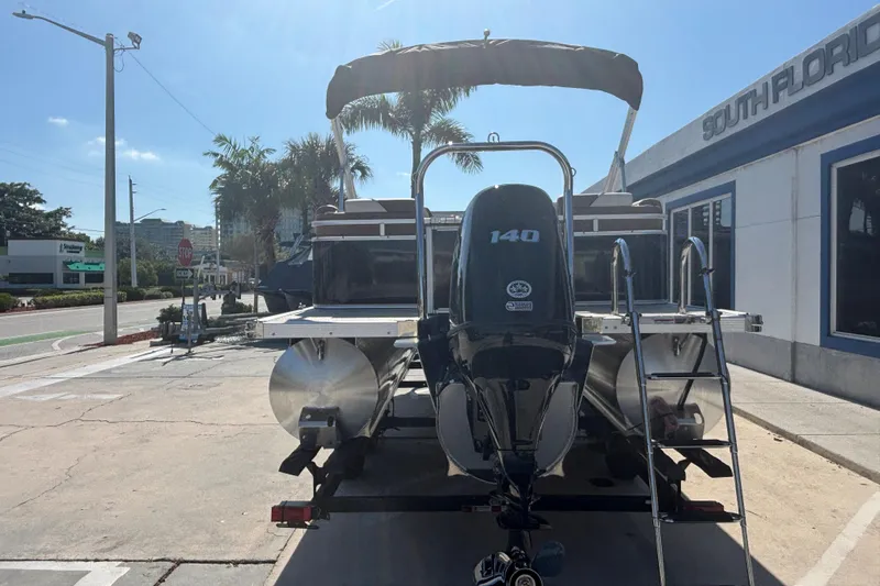 Slide: The Image of 2026 Tahoe Pontoon Sport 85 Quad Lounge with 140 HP engine at South Florida dealership. - 3