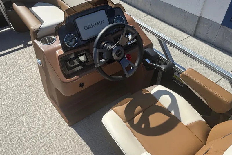 Slide: The Image of 2026 Tahoe Pontoon Sport 85 Quad Lounge dashboard with Garmin navigation system. - 8