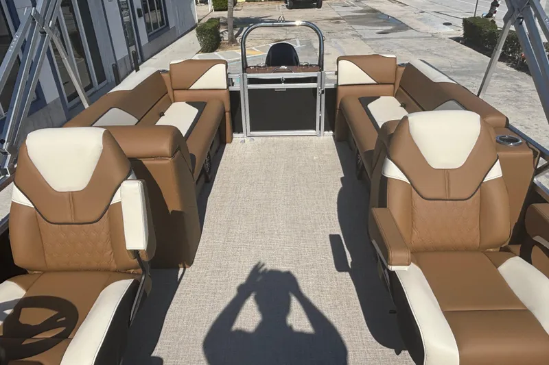 Slide: The Image of 2026 Tahoe Pontoon Sport 85 Quad Lounge with luxurious brown and cream seating. - 9