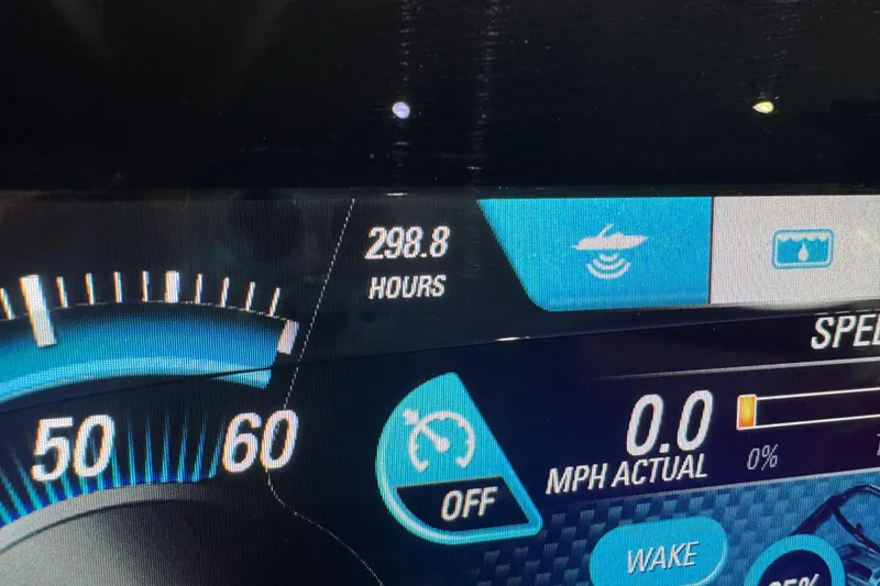 Slide: The Image of Dashboard of 2019 Malibu Wakesetter 21 MLX showing 298.8 hours and speedometer. - 19
