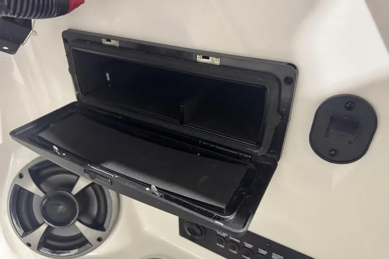 Slide: The Image of Open storage compartment on 2019 Malibu Wakesetter 21 MLX boat interior. - 20