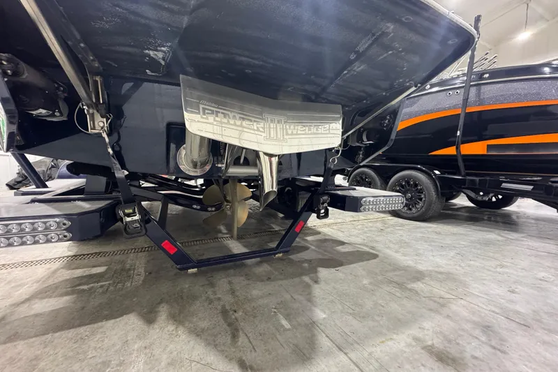 Slide: The Image of 2019 Malibu Wakesetter 21 MLX boat underside with propeller and Power Wedge III. - 3