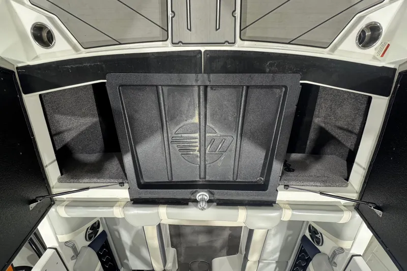 Slide: The Image of 2019 Malibu Wakesetter 21 MLX interior storage compartments and seating area. - 8