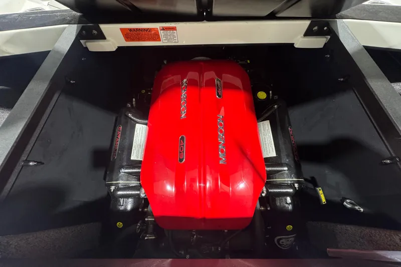 Slide: The Image of 2019 Malibu Wakesetter 21 MLX engine compartment with red Monsoon 409 engine. - 9