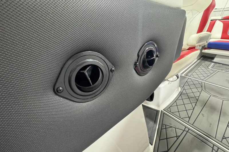 Slide: The Image of Rear view of a 2021 Tigé 25ZX boat showing exhaust and trim tabs. - 22