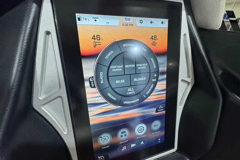 Slide: The Image of 2021 Tigé 25ZX boat interior with red, white, and blue seating, featuring cup holders. - 28