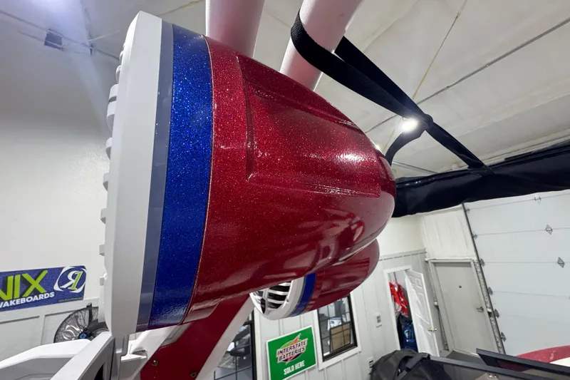 Slide: The Image of Interior of 2021 Tigé 25ZX boat with modern steering and touchscreen display. - 30