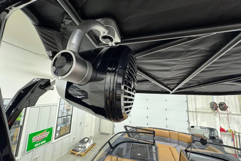 Slide: The Image of 2026 Moomba Tykon boat with advanced speaker system under black canopy. - 20