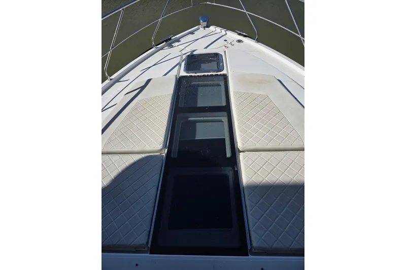 Slide: The Image of 2018 Cruisers Yachts 54 Cantius bow with sunpads and sleek design. - 33