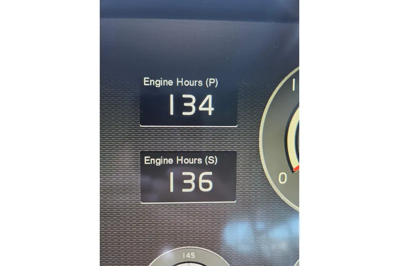 Slide: The Image of Engine hours display on 2018 Cruisers Yachts 54 Cantius, showing 134 and 136 hours. - 7