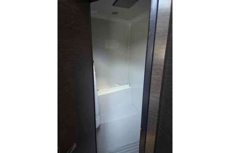 Slide: The Image of Shower area inside 2018 Cruisers Yachts 54 Cantius, featuring sleek modern design. - 12