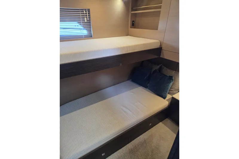 Slide: The Image of 2018 Cruisers Yachts 54 Cantius cabin with bunk beds and modern interior design. - 35
