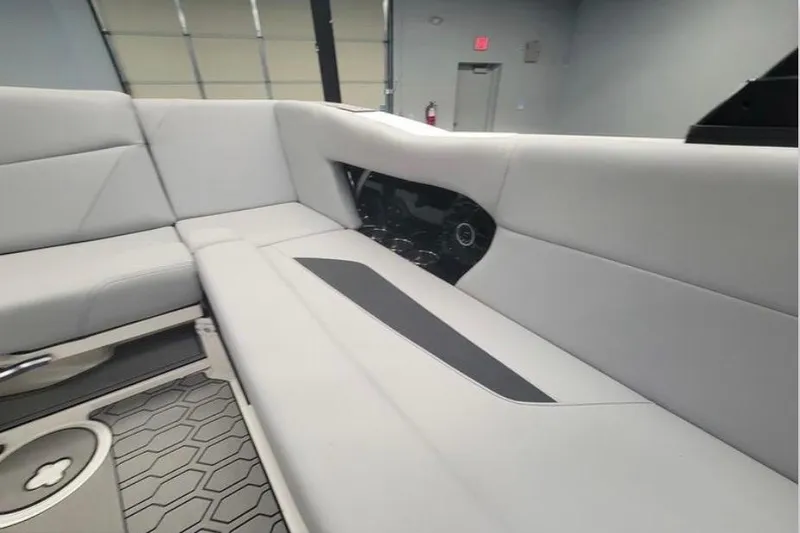 Slide: The Image of 2022 MasterCraft NXT24 interior with sleek gray seating and modern design elements. - 12